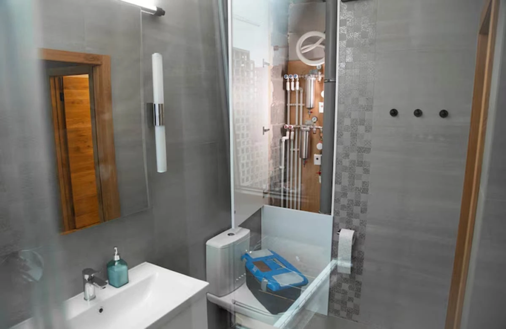 This sleek bathroom remodeling in Austin, TX, features a contemporary design with minimalist elements and clean, geometric lines that add sophistication.