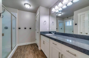 This sleek design by expert bathroom remodelers in Austin features a spacious layout, updated fixtures, and clean finishes ideal for functional living.