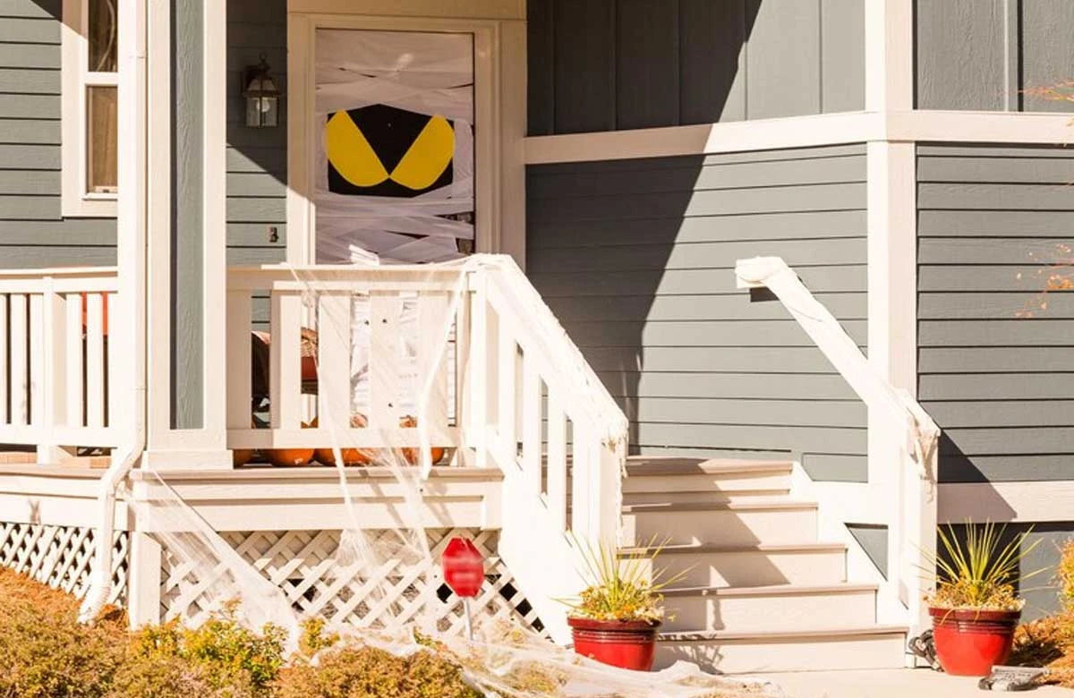 A festive front porch highlights how simple exterior upgrades and décor can boost curb appeal—an essential part of home improvement in Austin.