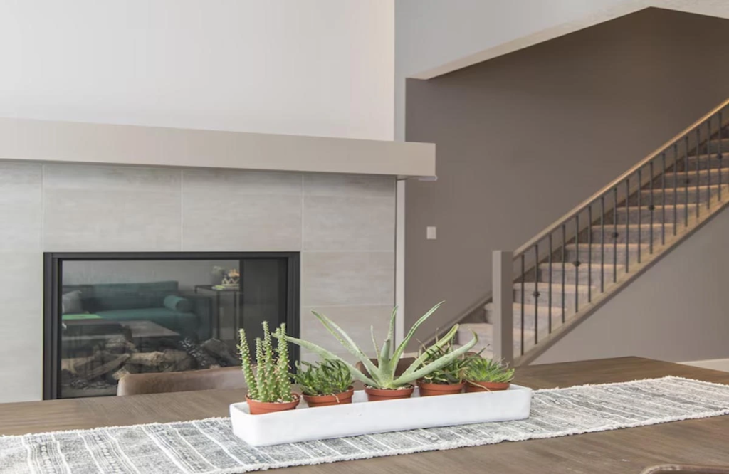 This stylish indoor fireplace and elegant décor showcase how thoughtful home improvement in Austin can transform interior living spaces with minimal updates.